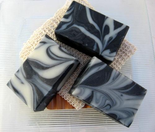 Organic Charcoal Bath Soap - An example of a Charcoal Soap.
Benefits:
- Cleanses, purifies and balances the skin. It draws out impurities.
- Acts as a natural disinfectant and gently removes dirt and dead skin cells.
- Helps improve skin diseases like acne, eczema and psoriasis. Organic Charcoal Bath Soap - An example of a Charcoal Soap.
Benefits:
- Cleanses, purifies and balances the skin. It draws out impurities.
- Acts as a natural disinfectant and gently removes dirt and dead skin cells.
- Helps improve skin diseases like acne, eczema and psoriasis.