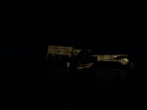 flipped plane - It's dark,with a phone camera,through a chain link fence! but You can make out the wing being on the ground,and a Tanker truck (the right way up!) in the background...