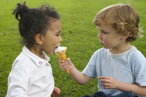 File sharing  - Someone shares his ice cream with a friend.