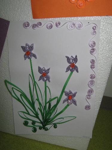 bouquet of flowers - Work done quilling technique. This time the rolls of paper are pressed into two opposite sides look to have leaves or petals. We are impressed spiral border of pale violet