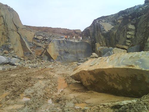 granite quary  - the pic is about the huge granite stone which is extracting from a granite quary tyhat is like a hill r mountain ,this is how a granite block is extracted