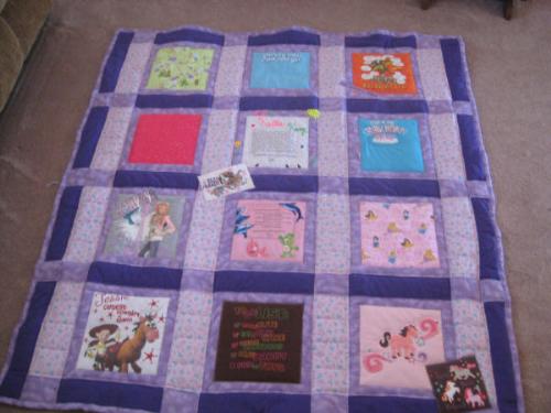 T-shirt Quilt 2 - Just finished the t-shirt quilt for my 5yo GD...didn&#039;t have many t&#039;s to choose from so some of the blocks are fabric of things that meant something to her, like fabric from the first princess dress I made her, from the toothfairy pillow I made her and she likes the Disney princess&#039; so I have fabric for that. My label inthe middle and one from her fav cousin above it...60x60 and fleece on the back. Haven&#039;t given it to her yet, but she is gonna love it!