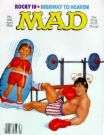 Poking Fun At - Shows a magazine cover of Mad Magazine where Sylvester Stallone is being poked in fun...