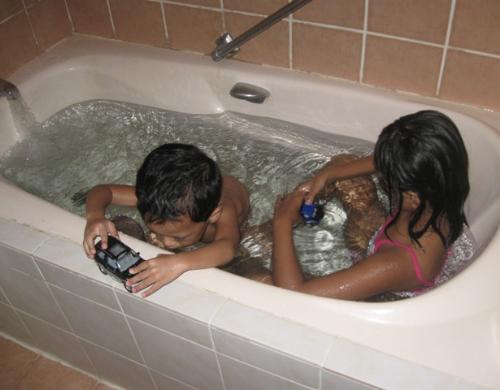 ...in the bathtub! - My kids were fond playing in the bathtub.   Andrei got his car in him to play it there.   They love the warm water this tub offers.  An experience they want to happen again...