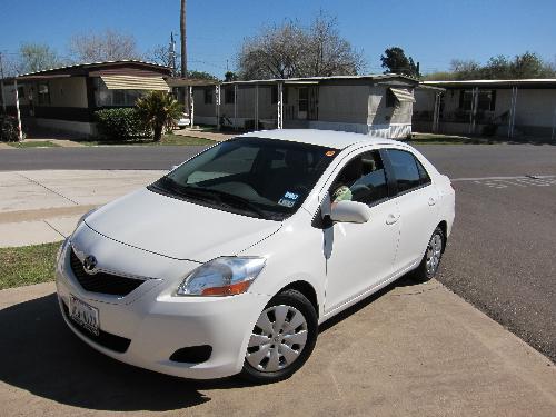 A white 2009 Toyota Yaris - I love this little car. Its big enough to take your friends, and small enough to be easy on gas!