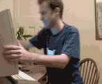 a virtual slapping XD - A funny gif of a man slapping himself on the other side
