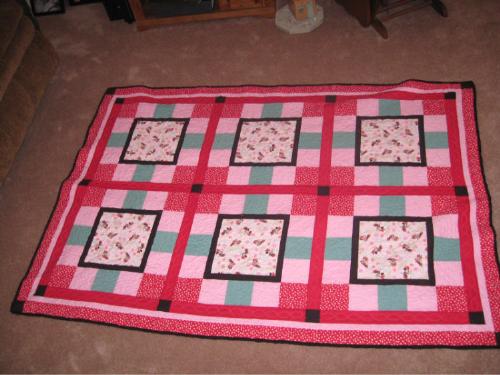 Minnie Mouse Quilt - This on is just a bit bigger than twin. I had hoped to have more Minnie on it, but she is hard to find in the fabric department! The back is fleece with full image of Minnie all over it!