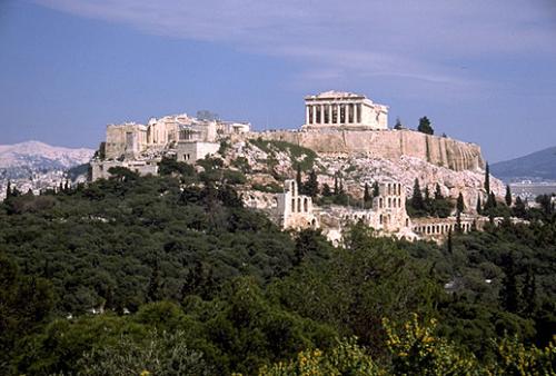 acropolis hill - View of the Acropolis from the southwest, showing the Propylaia, the Temple of Athena Nike, part of the Erechtheion, and the Parthenon. Also visible on the South Slope are the Odeion of Herodes Atticus and the Stoa of Eumenes.