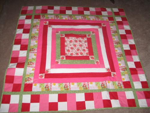 Strawberry Shortcake QUilt - I made this one...limited on the SS pattern fabric I couldn't find it! So I just made this the center square and worked my way outward with matching color sashing