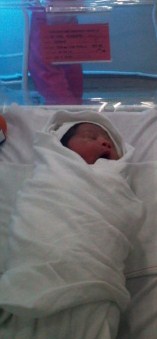 Baby's First Hours on Earth - There she is...yawning for a shot.
