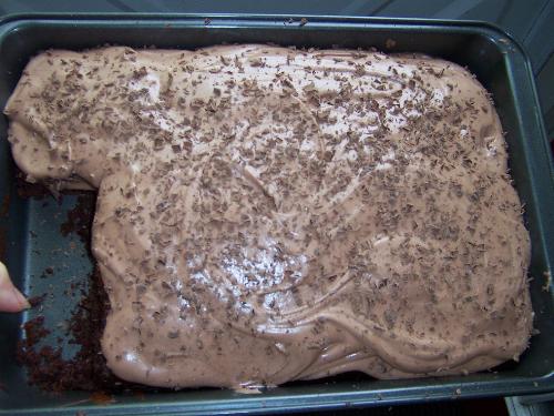 baking - I made chocolate cake today with chocolate whipped cream frosting and shaved chocolate pieces on top.