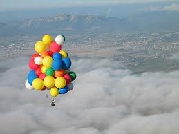 Multitude of the colorful balloons dancing in the  - See all the beautiful colours of these balloons rising in the sky high above the clouds.