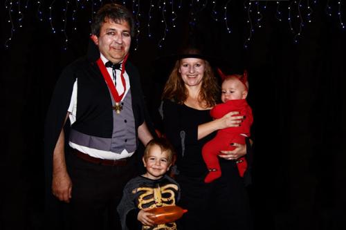 Family dressed in costumes - a whole family ready for Halloween.
