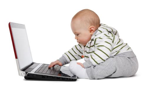 Baby working on laptop - baby working on laptop computer