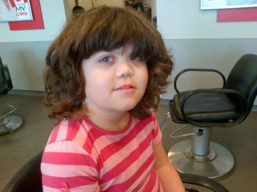 my daughter's hair just before her haircut - She has such a huge head of hair it took about 20 mins for a professional hair cut.