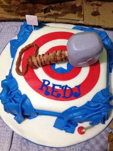My birthday cake this year - This was my birthday cake for this year's birthday celebration. The design is basically Captain America's shield and Thor's mjolnir or hammer.