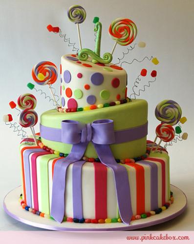 dream birthday cake! - Seeing this cake made me tell myself that one day I will have this on my birthday. It is a three layered cake with a lot of beautiful colors. It has different designs, from circles to swirls, and from stripes to ribbons. It is accented by colorful candy decorations.