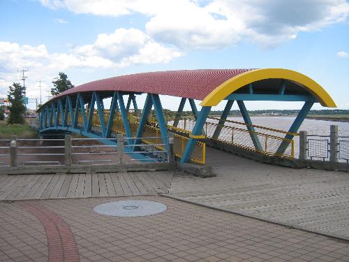 Moncton pedestrian bridge. - I always thought this pedestrian bridge was picturesque. It is along my route home from work. The boardwalk leading to it from the one side can be really slick in wet weather and the loose gravel on the other side can catch a bike rider a little unaware.