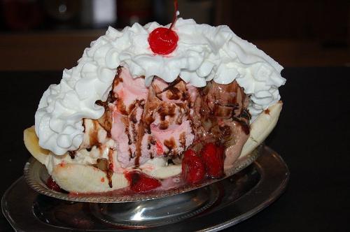 Banana Split is an ice-cream based dessert with a - Banana Split is an ice-cream based dessert with a banana cut in half