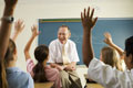 Teacher in a Class - This is a photo of a teacher handling a class of children in a school.