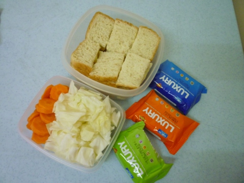 my food to picnic today - I prepared some egg mayo sandwich, some raw carrots and cabbage, and also a few packs of biscuits for picnic today.