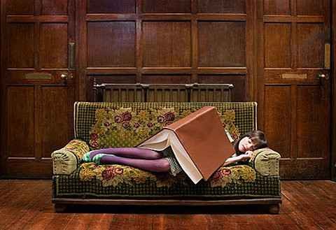 A girl sleeping while reading book - Study books is a good way for sleeps