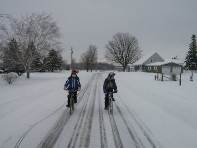 Cycling in the snow with two of my boys. - Picture of winter cycling quite a number of years ago. The snow on this run wasn't too thick.