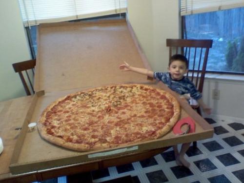 Yeah pizza!!! I hope I could help this kid out...l - This kid really needs some help, and I'm sure he can't finish off that pizza :)