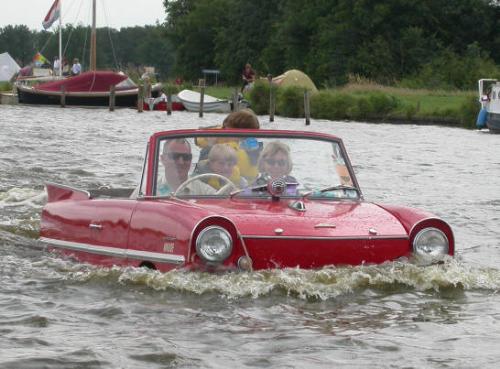 a dar driver driving his car - this is a wonderful picture of car driver who is driving his car in water... see it..