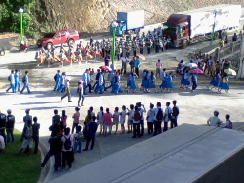 A view - A picture of an ongoing parade that we watched from our office window. Take note of the road by the mountain on the background. 