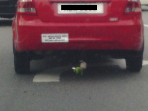 hanging stuffed toy - stuffed toy being hanged behind the car