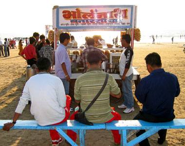 Bhel Puri Hawker - a common scene on Indian beac - No trip to the beach is complete without savouring the bhel puri a speciality one sees on Indian beaches.