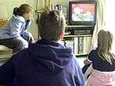 children watching tv - they never want to miss their favorite cartoons even they are at other home. children watching tv - they never want to miss their favorite cartoons even they are at other home.