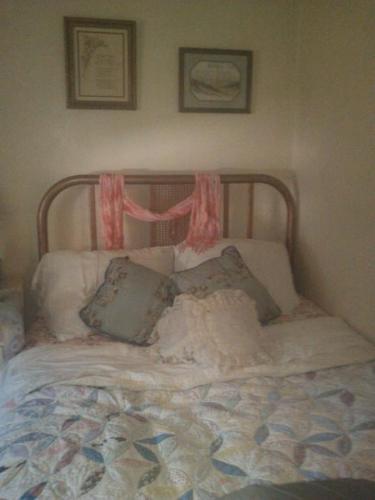 My Restored Antique Iron bed. - I stripped and sanded the layers of paint, then sprayed it with Rustoleum Hammered Bronze paint.
