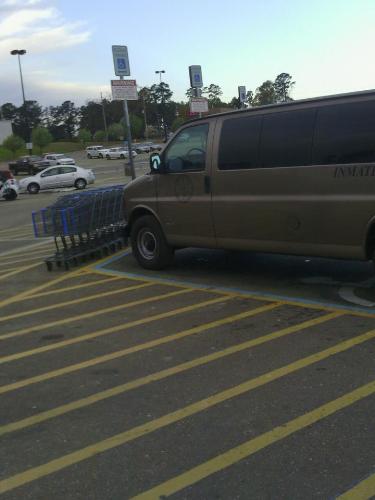 Inmate transport van - Van parked in a handicapped parking spot at local store.