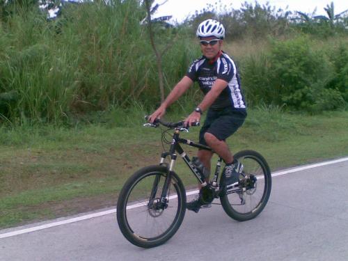 Biker - Biking all the way to and fro.