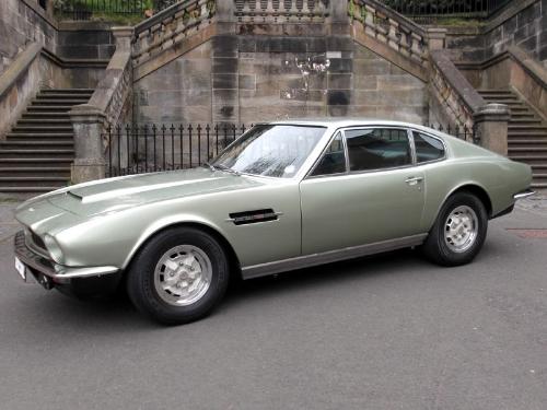Aston Martin V8 Coupe - An Astom Martin V8 Coupe parked at the steps of a stately home.