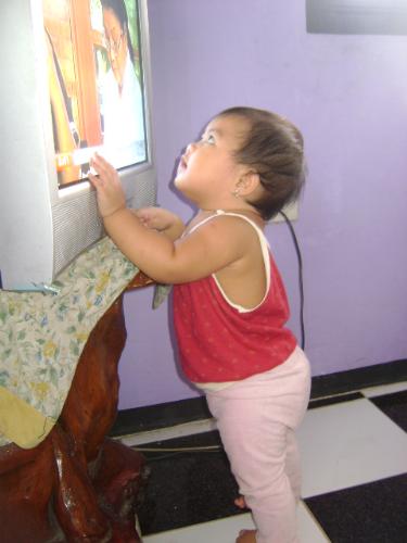 zami watching TV - my daughter as she watches TV