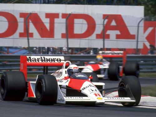 Alain Prost and Senna - This is a photo of the legendary 1988 season when Mclaren won 15 out of the sixteen races with Senna winning the championship because he won 8 races to Prost's 7.