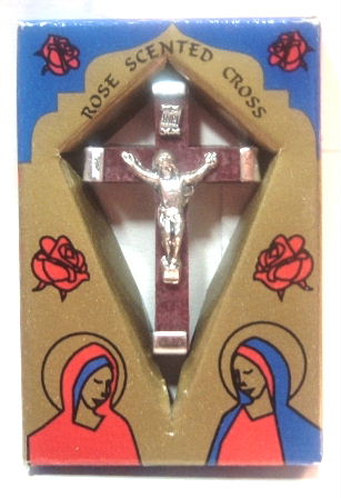 Beautiful Rose Petal Crucifix - Beautiful Rose Petal Crucifix This is something that I sell to make a little extra money.  This beautiful crucifix is imported from the Holy Land. and measures about 1 3/4' x 1 1/16'. It is made from real crushed rose petals that grow in the Holy Land.    Lovely packaging makes it great for gift-giving. It is not only a great gift it has a loop at the top that would make it a great addition to your supplies if you make rosaries or religious jewelry.    The explanation on the back of the gift box is in three languages and reads:' The cross is made of a special rose that grows in the Holy Land and symbolizes honesty, purity, and holiness.'   This crucifix is a wonderful treasure and the heavenly aroma of roses makes this crucifix very special.