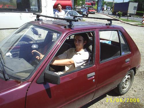 Me in Peugeot - This picture was taken a few months ago at work. I don't have my driving licence yet.. but i am still dreaming. Who knows? maybe someday. Altough i love that car. It's a junk but i am attached to it.