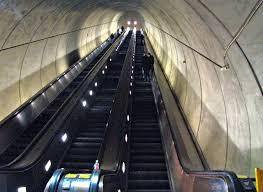 escalator credit https://commons.wikimedia.org/wiki/File:Wheaton_escalator_from_bottom_right.jpg escalator credit https://commons.wikimedia.org/wiki/File:Wheaton_escalator_from_bottom_right.jpg