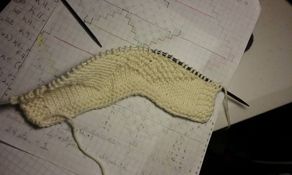 The start of a washcloth of my own design based on quilt block square The Card Trick.