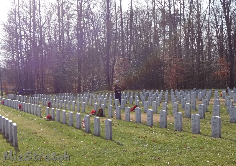 Lone bugler after playing TAPS at conclusion of ceremony for the fallen of all military branches at Quantico National Cemetery, VA