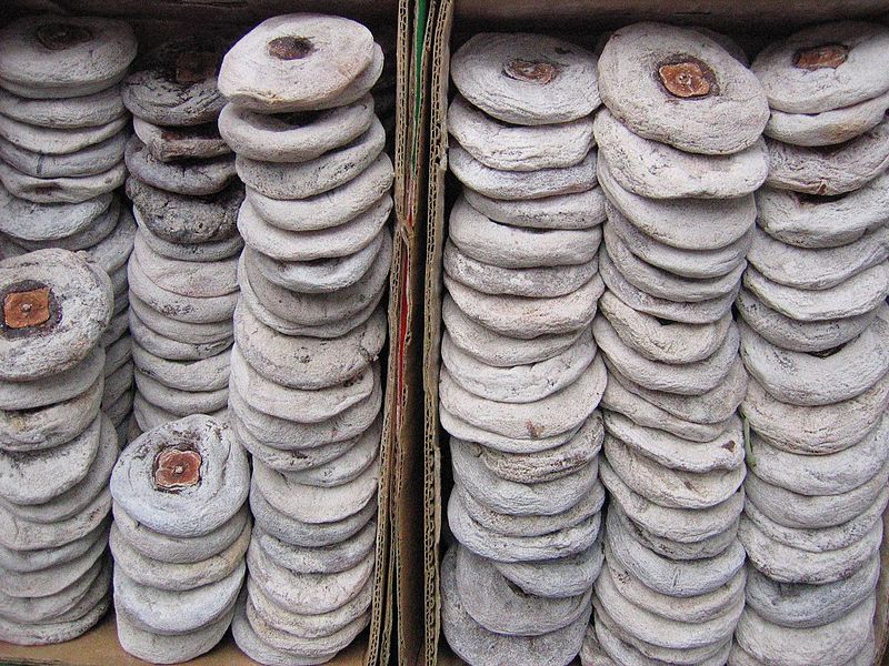 peeled and flattened persimmons drying in a Chinese market peeled and flattened persimmons drying in a Chinese market