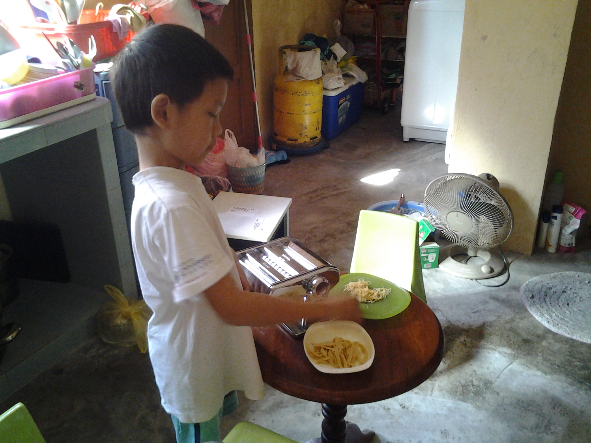 My son's making noodles