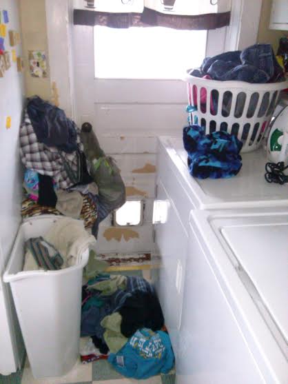 piled up laundry in my kitchen
