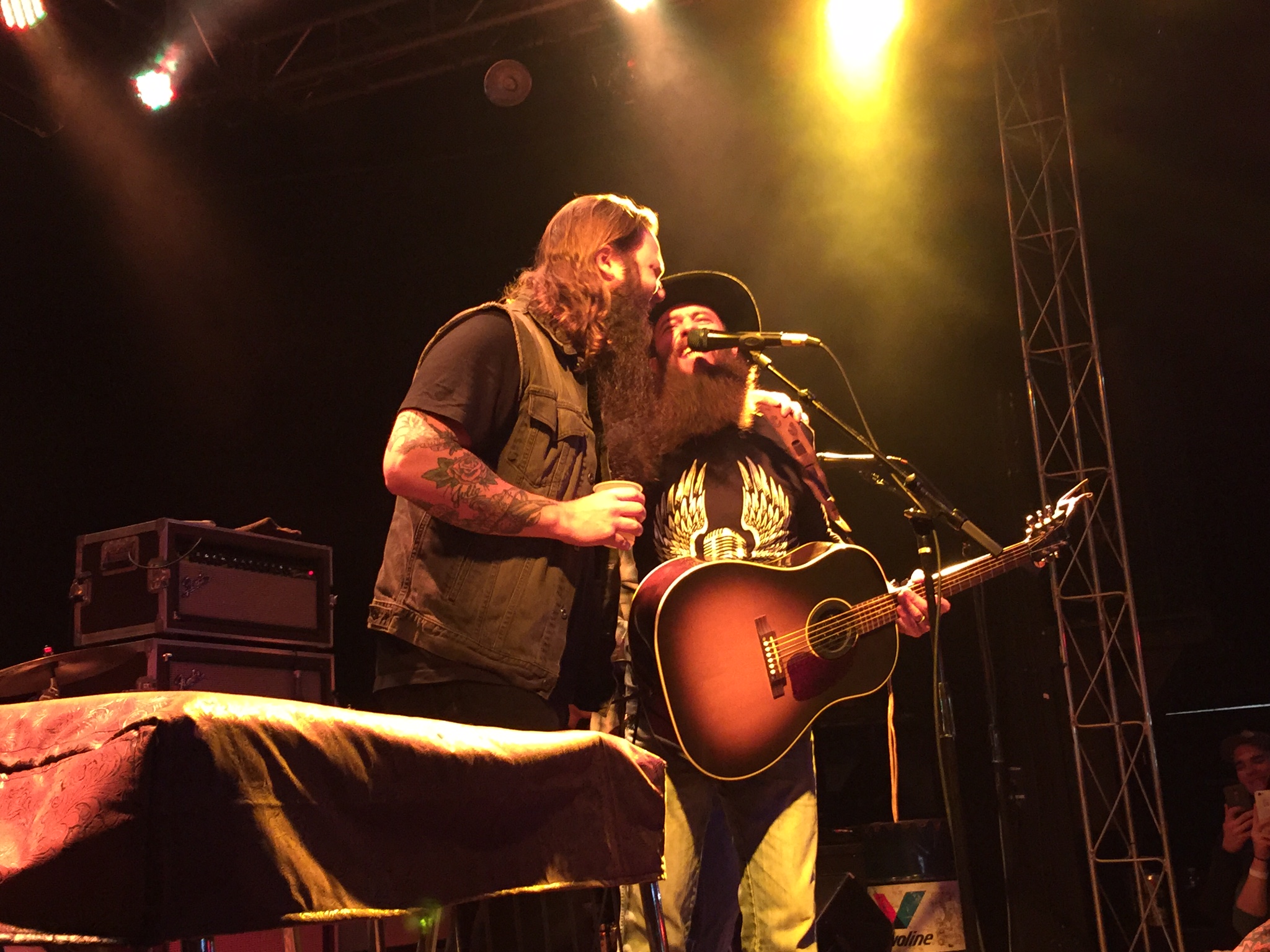 Whitey Morgan (left) joins Cody Jinks onstage to sing "Cast No Stones" during their joint-headlining show at Headliners in Louisville.  Photo taken by and the property of FourWalls.