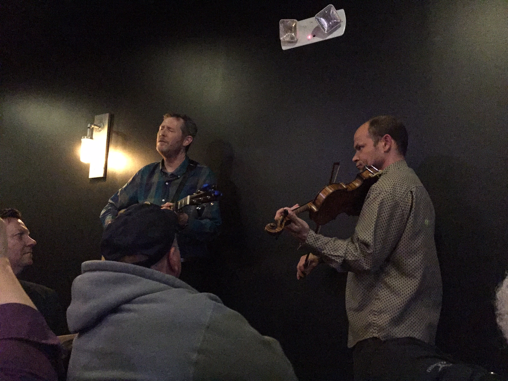 Robbie Fulks and Shad Cobb in the audience, singing at the conclusion of the April 2 concert in Carmel, Indiana.  Photo taken by and the property of FourWalls.