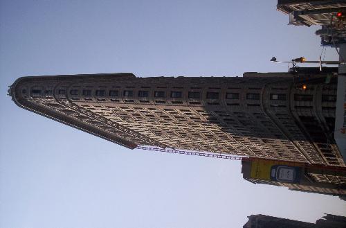 Flatiron Building- New York City - This is a photo I took of the Flatiron Building.  It is one of the most famous buildings in the world, and is located in New York City.  It's triangular shape comes from the bizarre plot of land which was available.  It is revered by architects worldwide.  At its smallest point, it is only six feet wide.